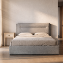 Cama canapé abatible tapizada en un dormitorio