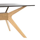 Mesa ELOISE de 140 cm, en negro con patas de roble, vista frontal