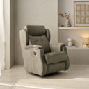 Sillón relax HYDRA con opción giratoria, en beige, en un salón con hornacina