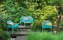 Sillones Net Relax en salice con sofá Net Bench, en un jardín – Nardi